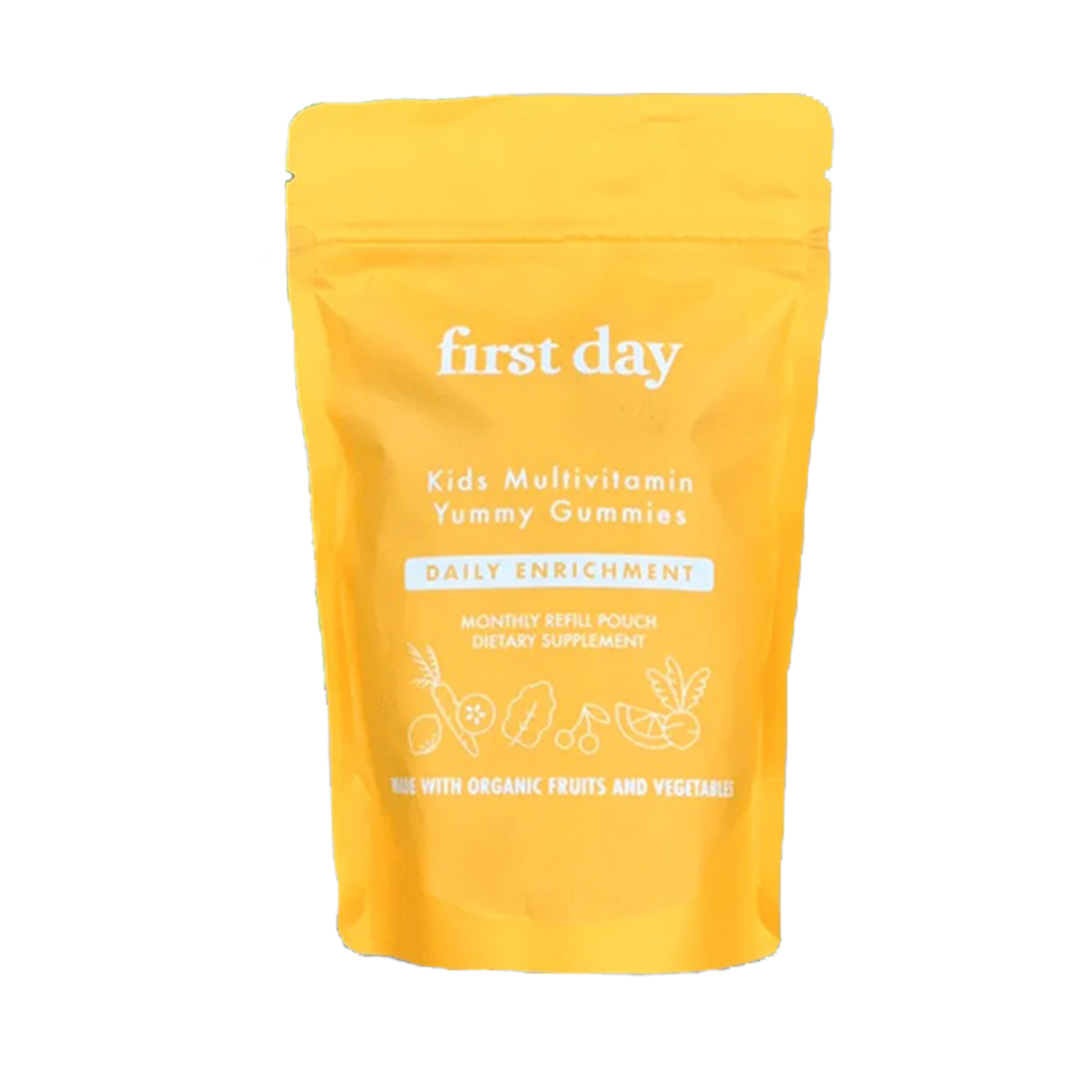 A yellow resealable pouch labeled Kids Enrichment - Refill Pouch contains Kids Multivitamin Yummy Gummies. The package features "Daily Enrichment" and "Made with Organic Fruits and Vegetables" in white text.