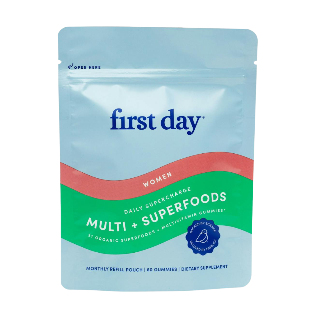 A resealable pouch labeled Womens Daily Supercharge - Refill Pouch, in blue, green, and red. Contains 60 organic superfood gummies with nutrients to combat fatigue. Text highlights monthly refill and dietary supplement.
