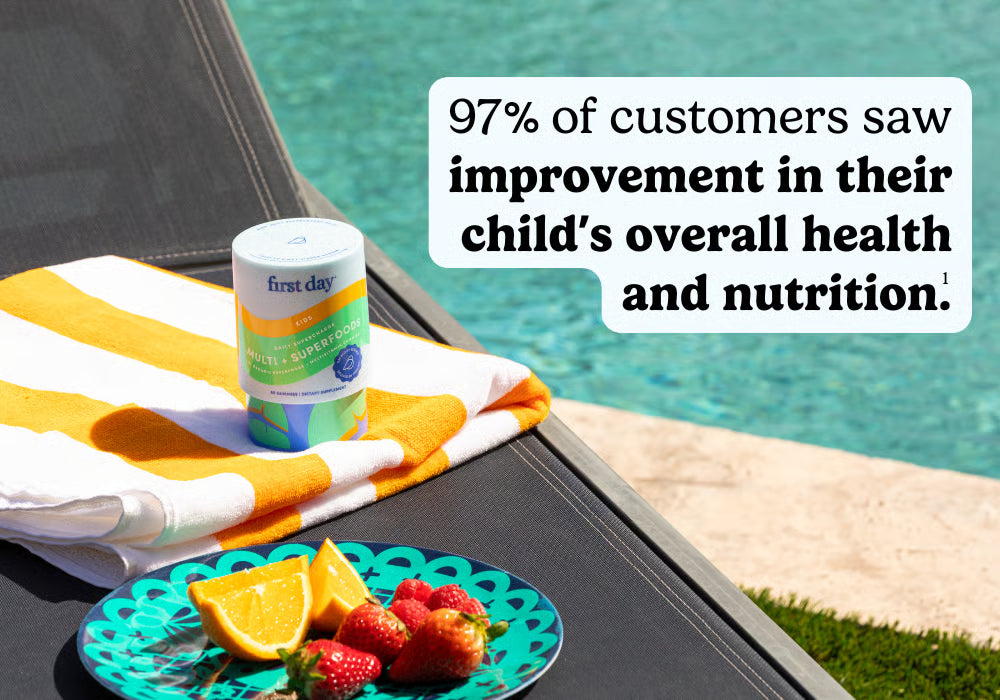 First Day of Summer product with fruit on a table by a poolside