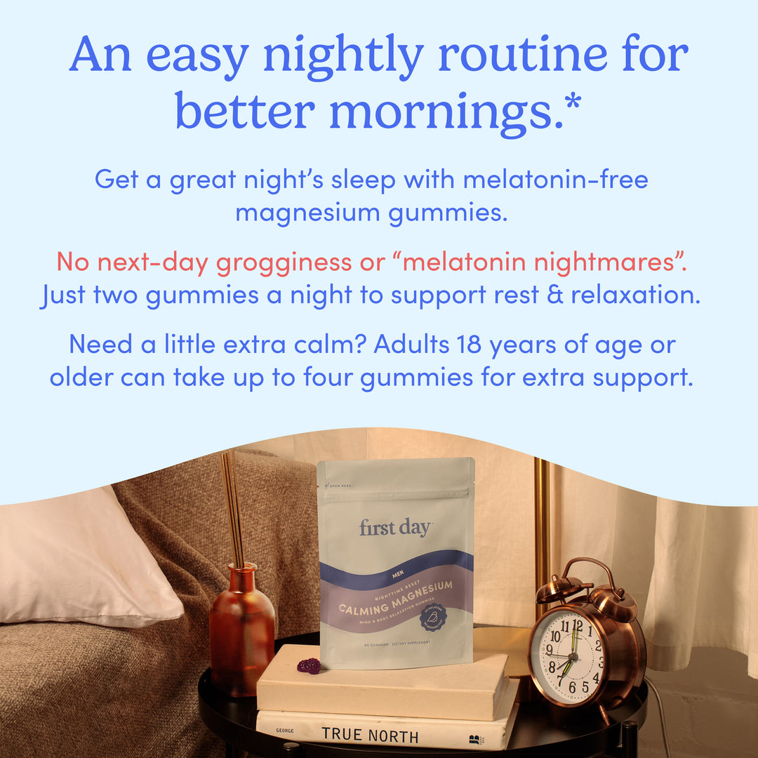 A pouch of Men’s Nighttime Reset Calming Magnesium gummies rests on a round table beside an alarm clock, glass of water, candle, and book. These melatonin-free gummies support restful sleep in a calm nighttime atmosphere.