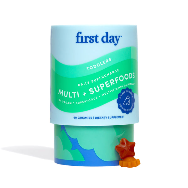 Multivitamin gummy container with 'first day' branding on a white background