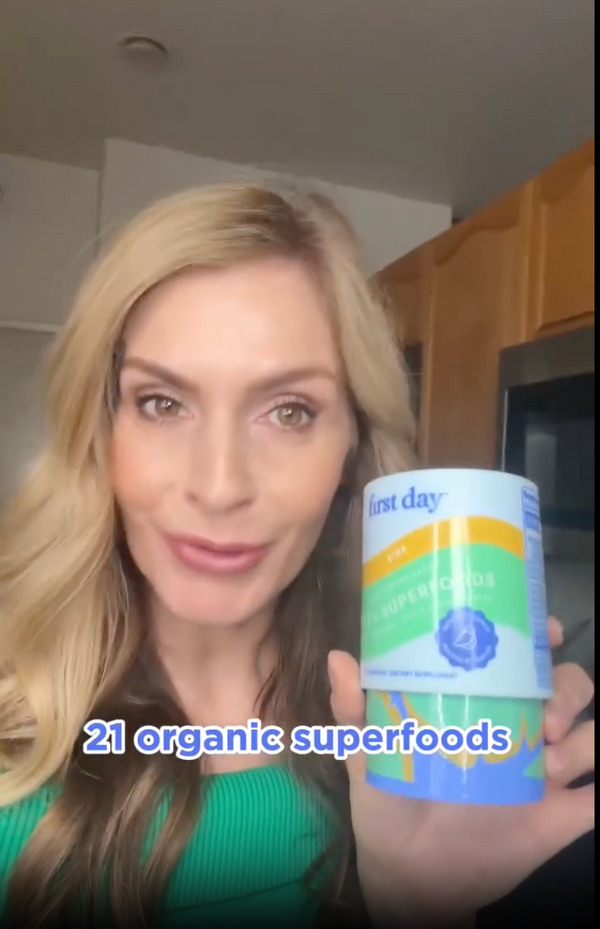 Woman holding multivitamins