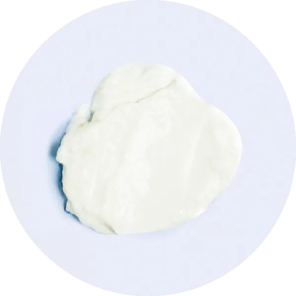 A small dollop of plain white yogurt on a clean, white background.